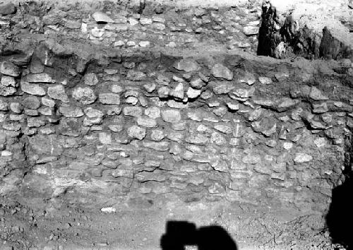 View of excavation site, and shots of artifacts