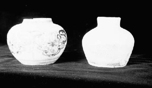 Two pottery jars, one decorated