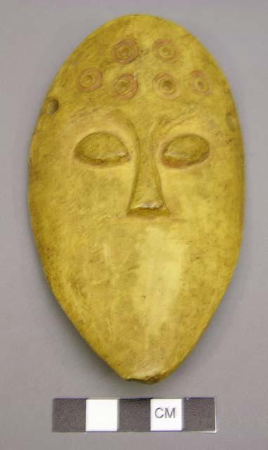 Ivory mask with incised forehead, no mouth, 5" h.