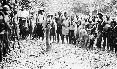 Fishing party with caught fish and tools including rods