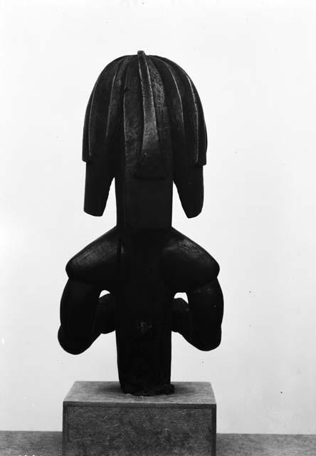 Wooden figurine back view, female god