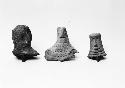 Three heads of bird figurines