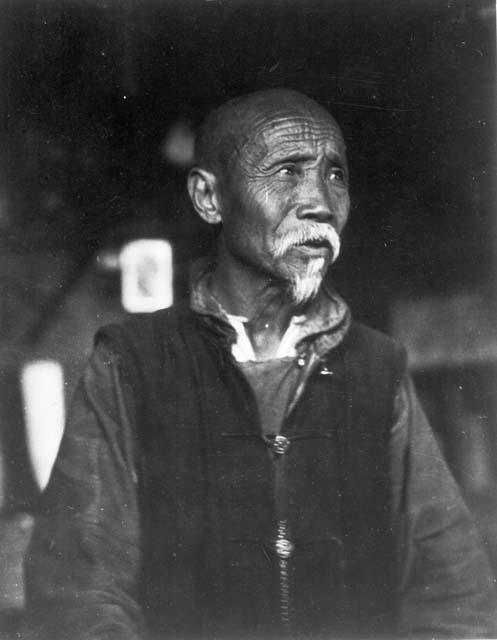 Portrait of Old Shopkeeper