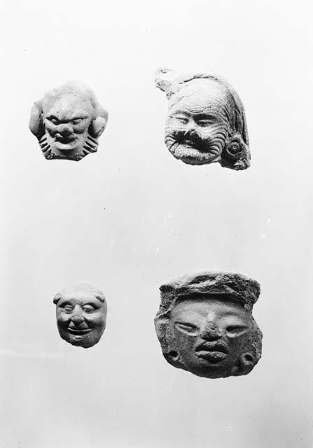 Four carved figurine fragments