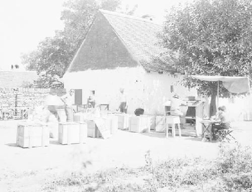 View of men packing up in the field house yard