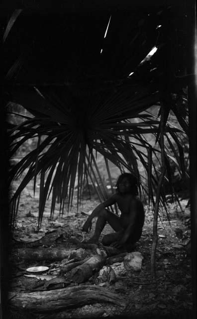 Man sitting under tree