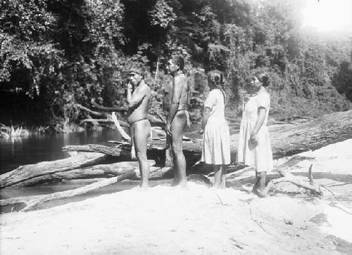 Physical types , father and son with their wives, side view