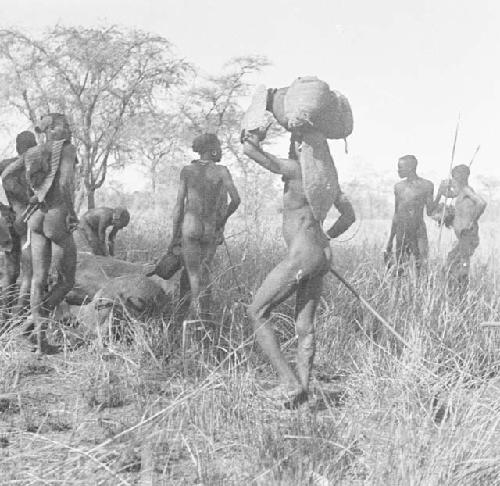 Karamojong carriers putting down loads on reaching Nabagut