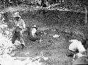 Excavating Pit House D, Showing Bedrock Wall