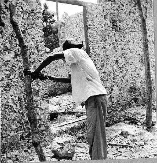 Narsario Chi making a huacal: wringing juice from heated henequen leaf