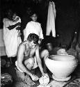 Modern pottery making - resting on a kabal which in turned by the hands or feet