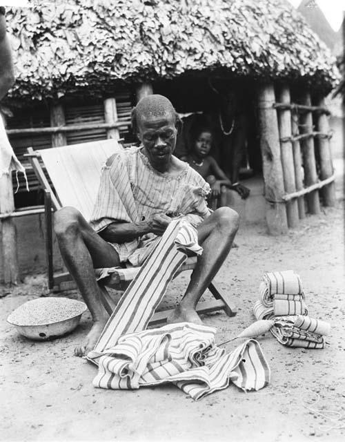 Chief sewing striped cloth