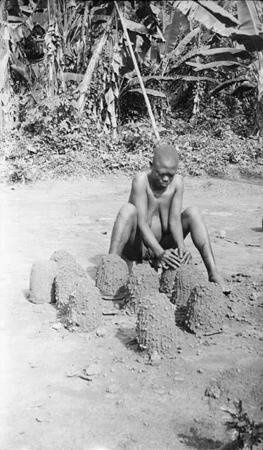 Woman making clay pot rests