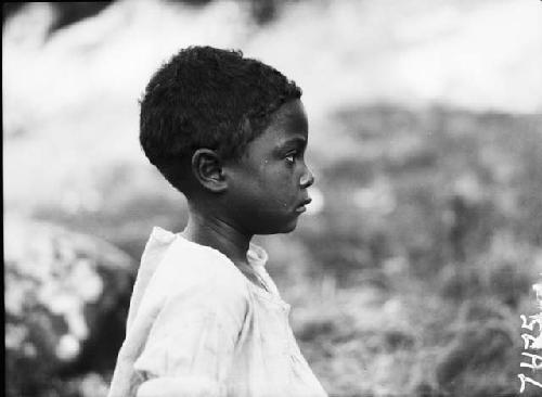 Profile view of young, mixed race boy