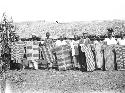 Men displaying decorative war shields