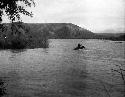 Horsemen fording river