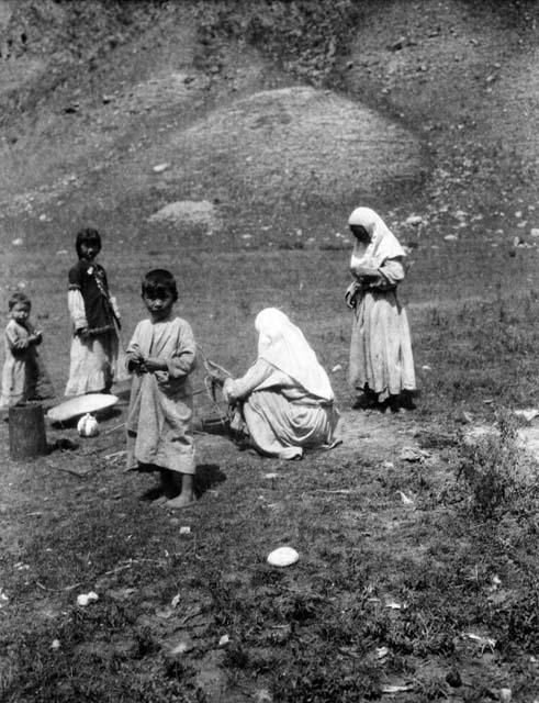 Kazak women and children at cooking hole