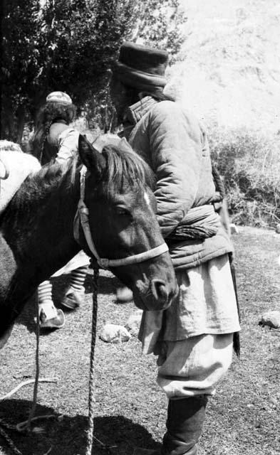 Pack horses and man, probably Ladakhi