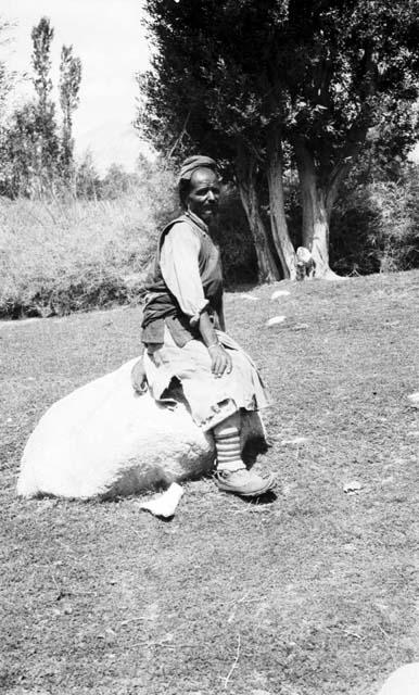 Man sitting on boulder