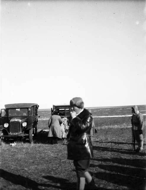 General Tsou Tso-hua in front of cars