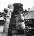 Sculpured stone human figure and jaguar pedestal sculpture