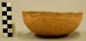 One half of a Jeddito black-on-yellow pottery bowl