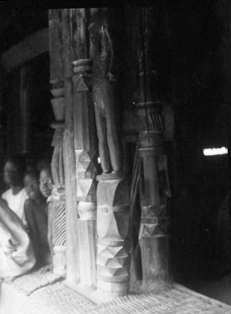 Carved posts at the entrance to a Loma Palaver house