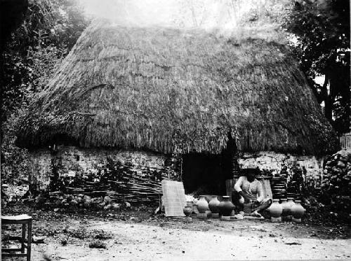 Modern Maya potter starting a vessel on a kabal about 1900