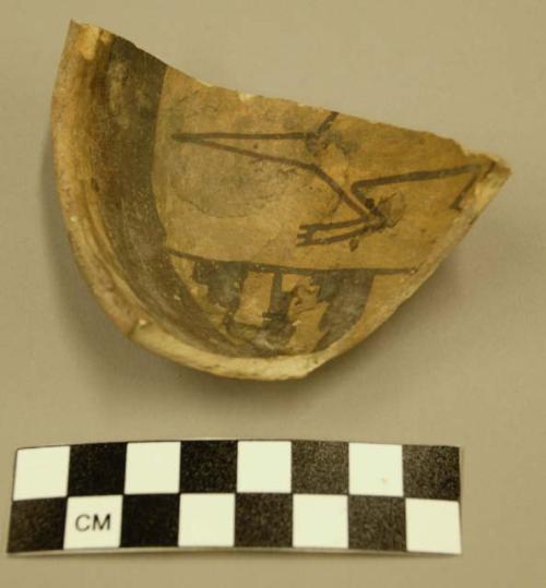 Fragment of small zoomorphic jeddito black on yellow pottery bowl