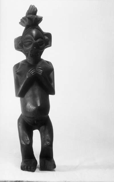 Wooden "pig-faced" female figure