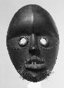 Black wooden mask, messenger for Lo La Glu