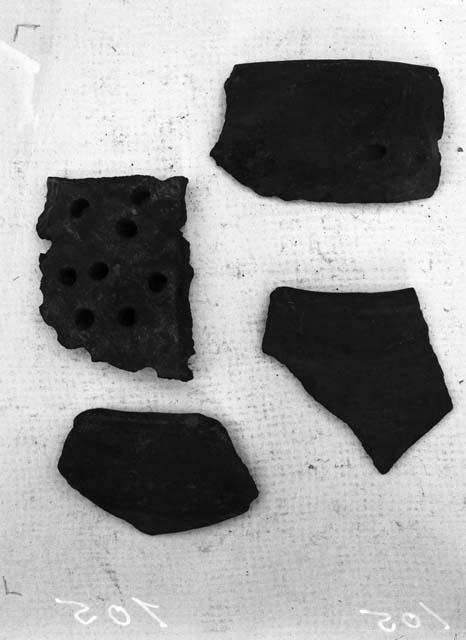 Miscellaneous semi subentaneous handle, two rim sherds