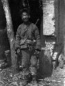 Old soldier standing in front of building