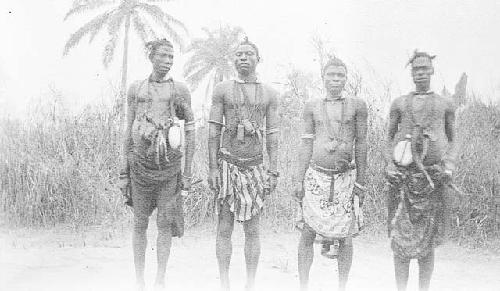 Men enroute to market with personal accessories, canteen, belt, purse, etc.