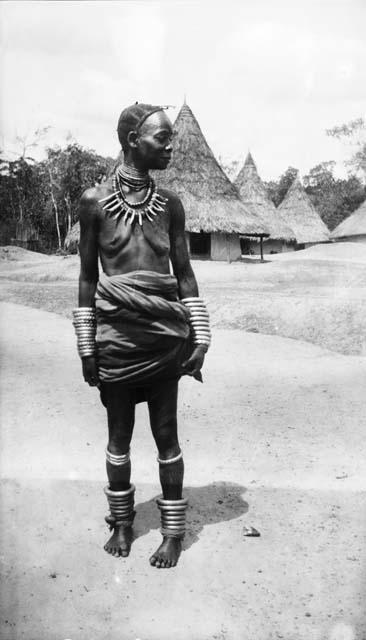 Woman covered in brass and beaded ornamentation, jewelry