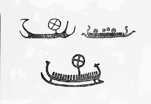 Rock carvings of boats with sun symbols