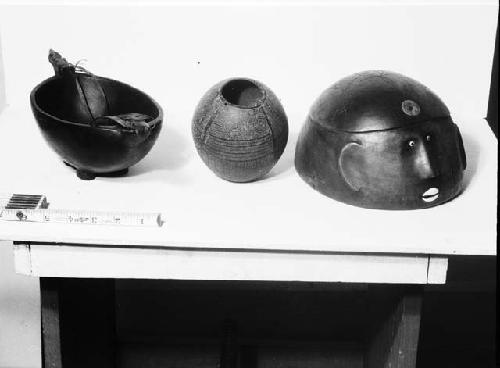 Ancestral image, engraved coconut cup and wooden bowl with carved handles