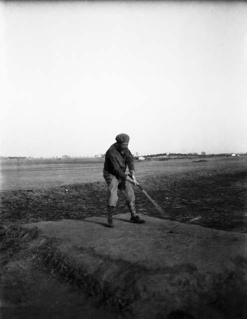 Marshal Chang Hsuch-liang addressing the ball, playing golf