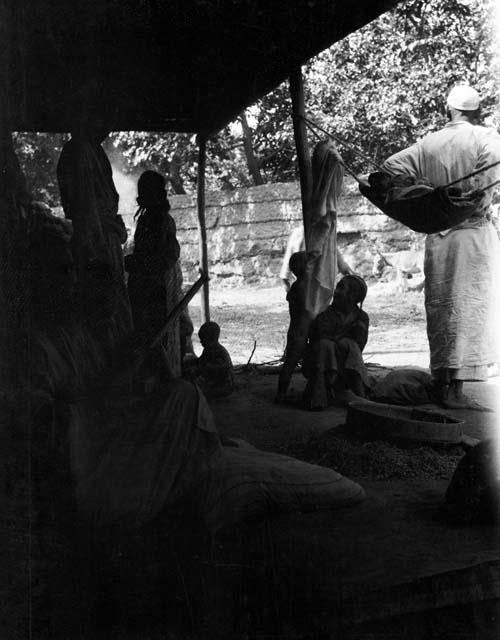 Oitoghraq, several people on a veranda with cradle swing