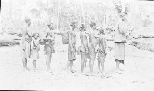 Bride being escorted by family to her husband's village