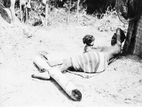 Kpelle female Debtor in stocks at Jensu