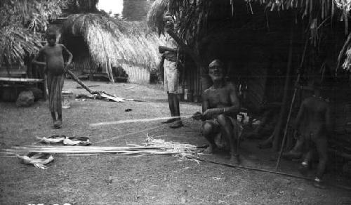 Man constructing basket, Sapo, Pudu clan