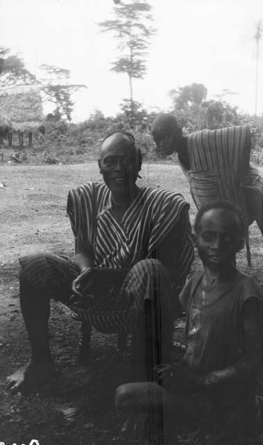 Man on stool with boys