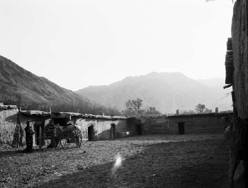 Inn, Davan Cheng, pass gorge, loaded cars, men standing by