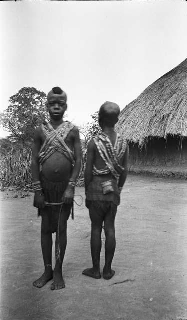 Two young boys in circumcisial dress