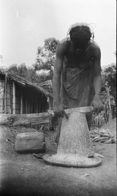 Women scraping mango block