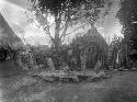 Chief sitting amongst arranged stone slabs