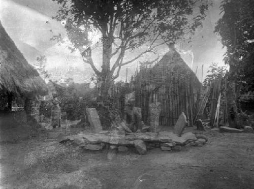 Chief sitting amongst arranged stone slabs