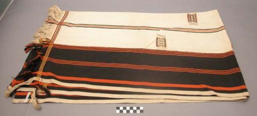 Cloths woven and worn by men (white with black & orange borders)
