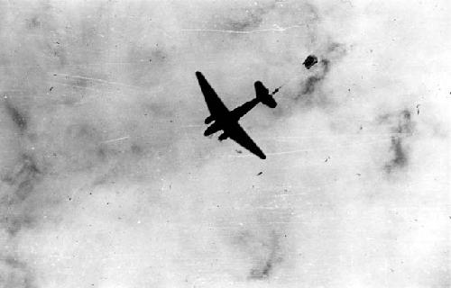 Paratrooper jumping out of airplane